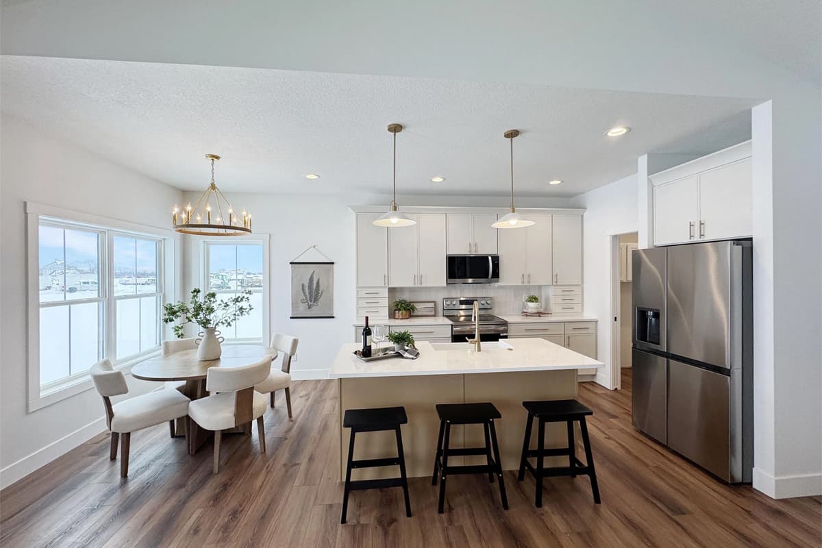 Open kitchen with island counter and dining table